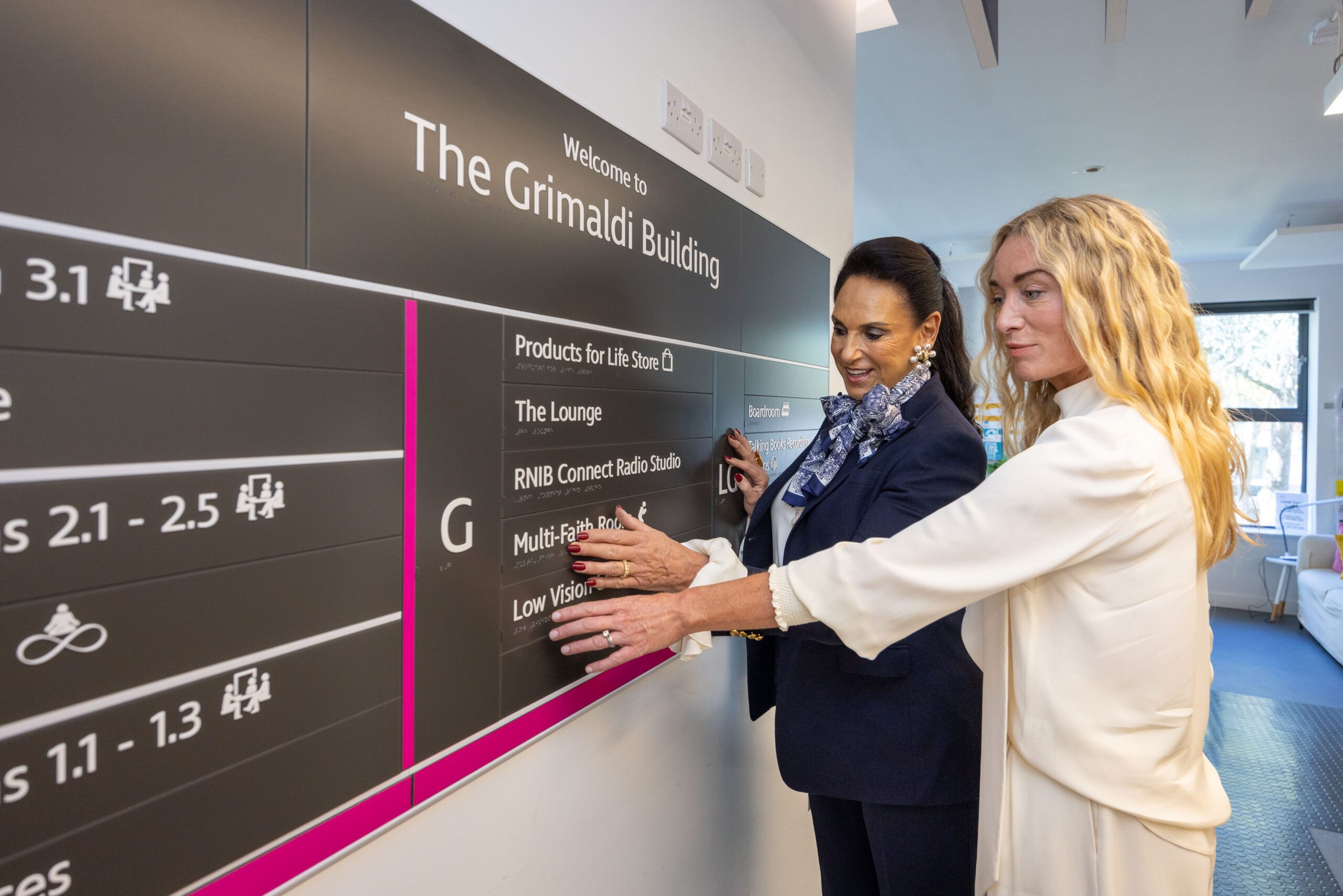 Dame Gail Ronson (left) hands over as RNIB president to Victoria Smurfit